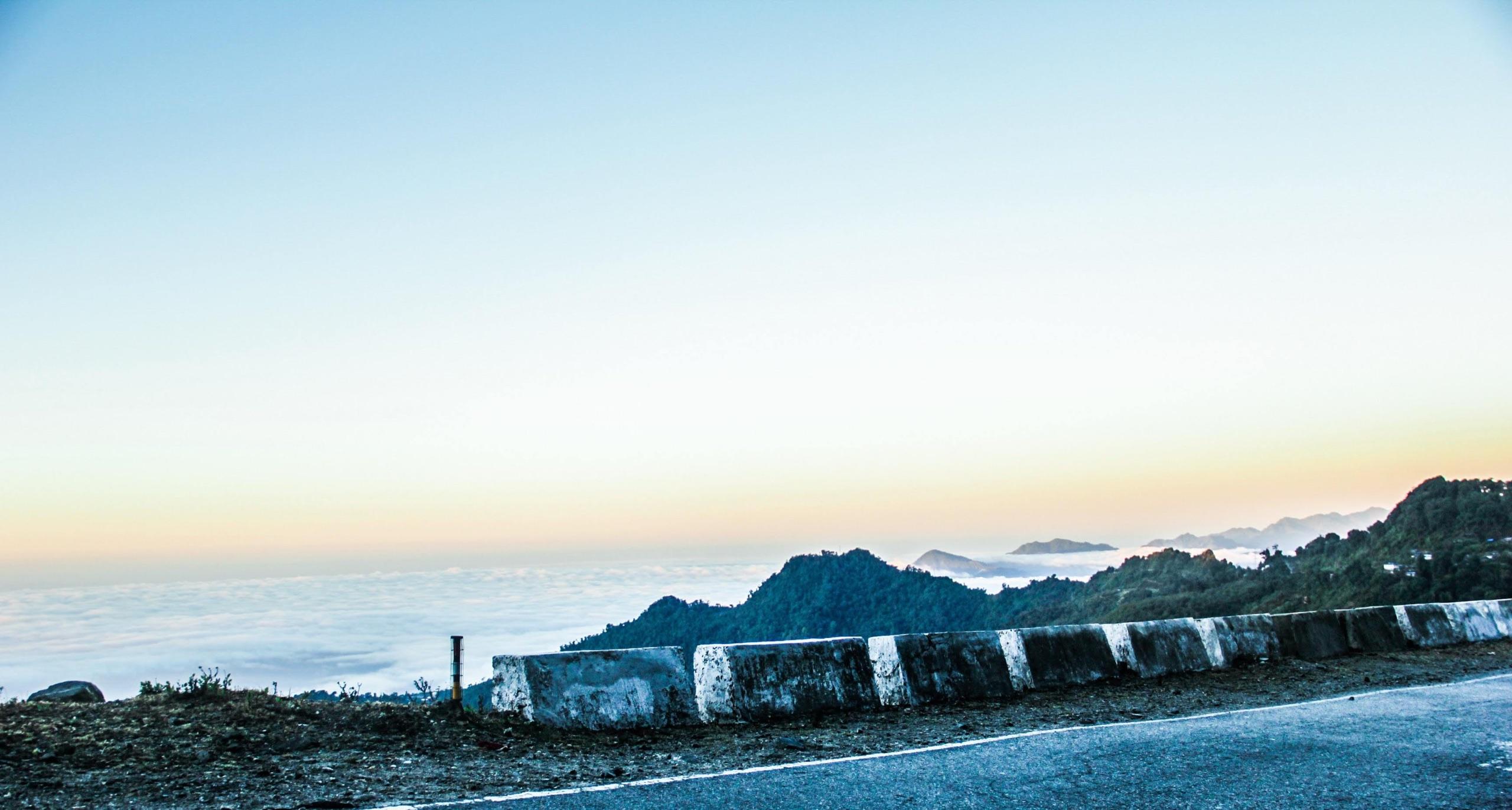 The Thimphu–Phuentsholing highway above layered mountains and cloud